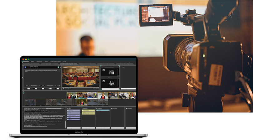 video camera recording a person giving a talk, in the foreground we see a laptop showing the interface of a video editing program on the screen.